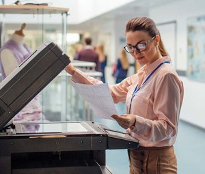 Person using printer in office