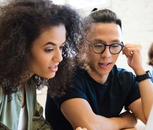 College students working together in class