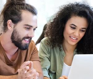 Students collaborating with tech