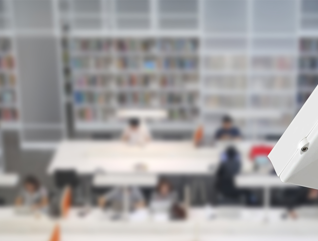 Camera overlooking students in the library