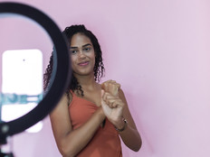 Woman recording tiktok dance on her mobile phone