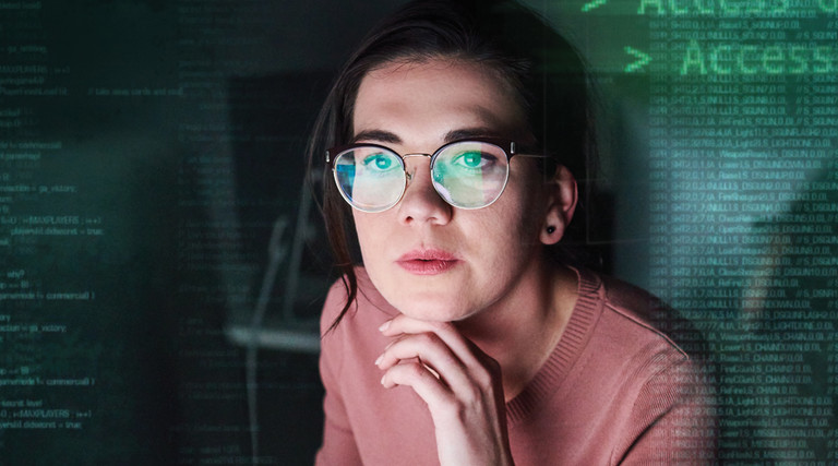 cybersecurity IT woman looking at screen