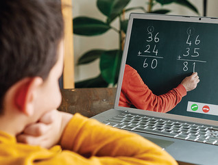boy using laptop at home