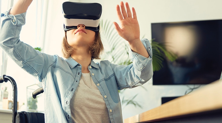 teenager in wheelchair using VR