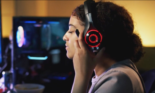K–12 student playing esports with headset