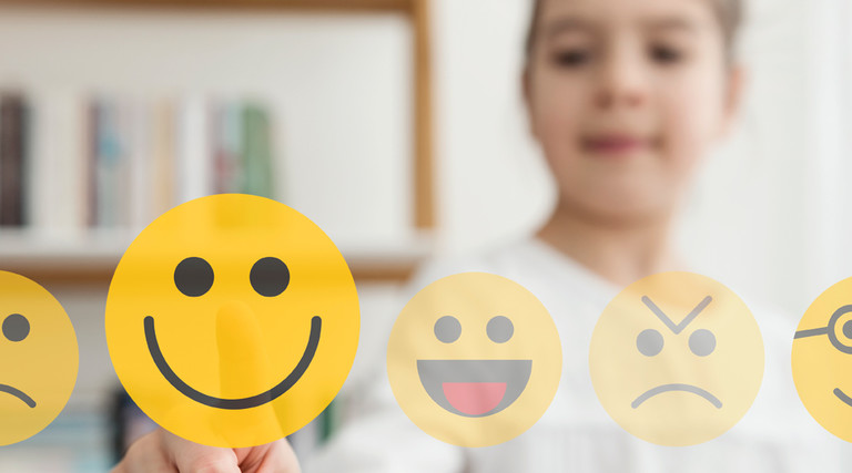 K–12 student chooses smiley face for good mental health in school