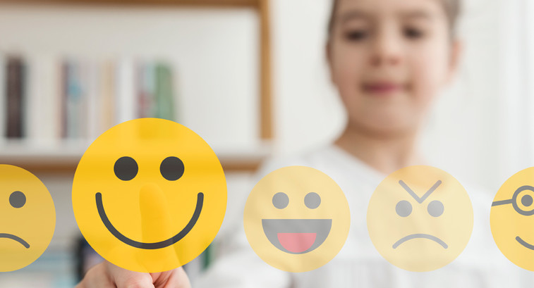 K–12 student chooses smiley face for good mental health in school