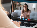 Woman talking on computer screen through videoconferencing 