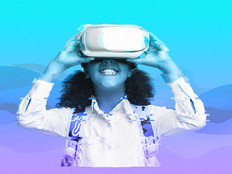 smiling student uses Virtual Reality headset