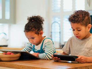 Students remote learning from their kitchen