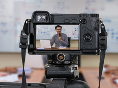 Teacher using AV camera in a classroom with students