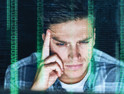 Man staring at computer with overlay of binary code