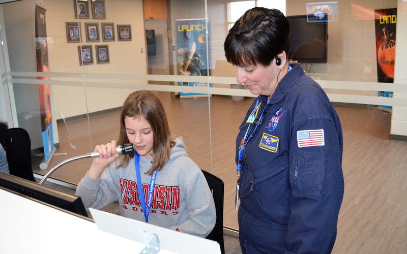Teacher with student at the Challenger Learning Center