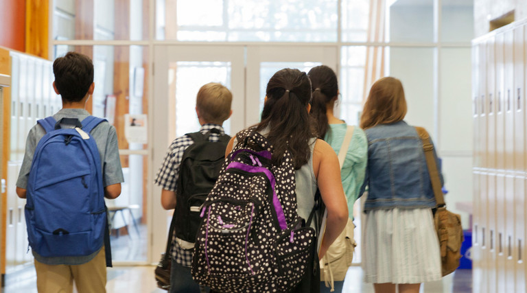 students walking the hall