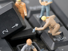 Miniature figurines work on computer keyboard