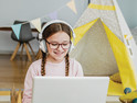 Girl using laptop for online school