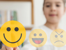 K–12 student chooses smiley face for good mental health in school