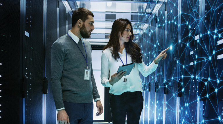 IT leader receives guidance in server room for network upgrades