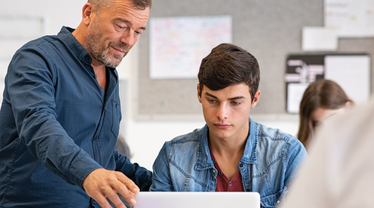 K–12 Educator Using Technology with Pedagogy in Classroom