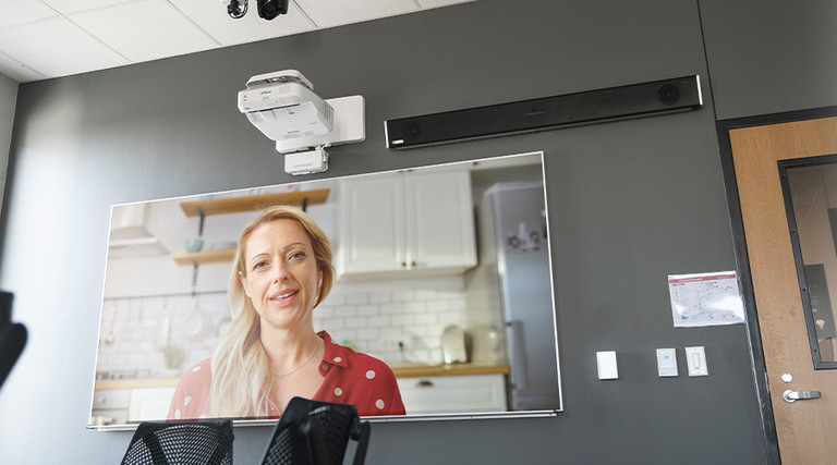 parent on screen in classroom for virtual conference