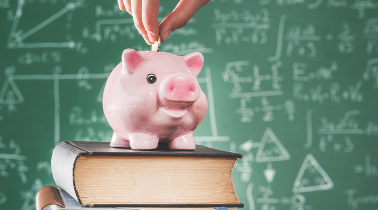 piggy bank on a stack of books