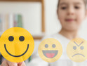 K–12 student chooses smiley face for good mental health in school