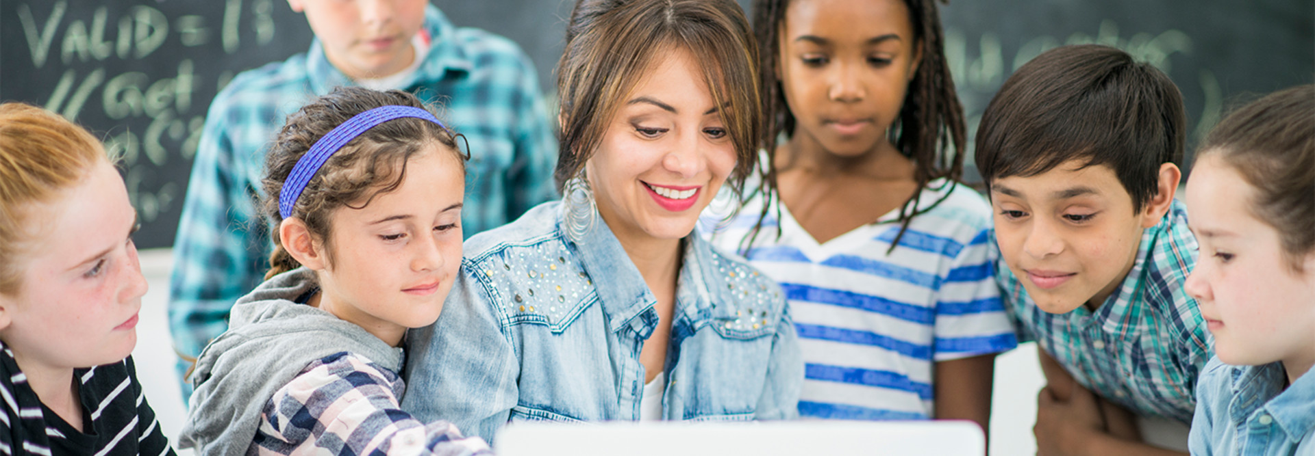 Kids and teacher using internet