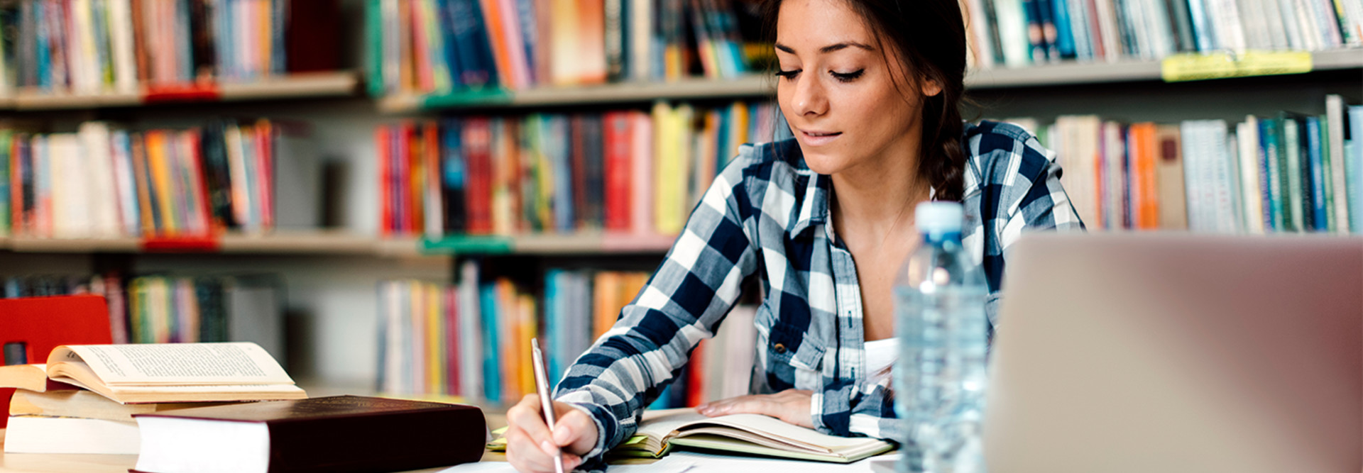Student using laptop for taking notes to study