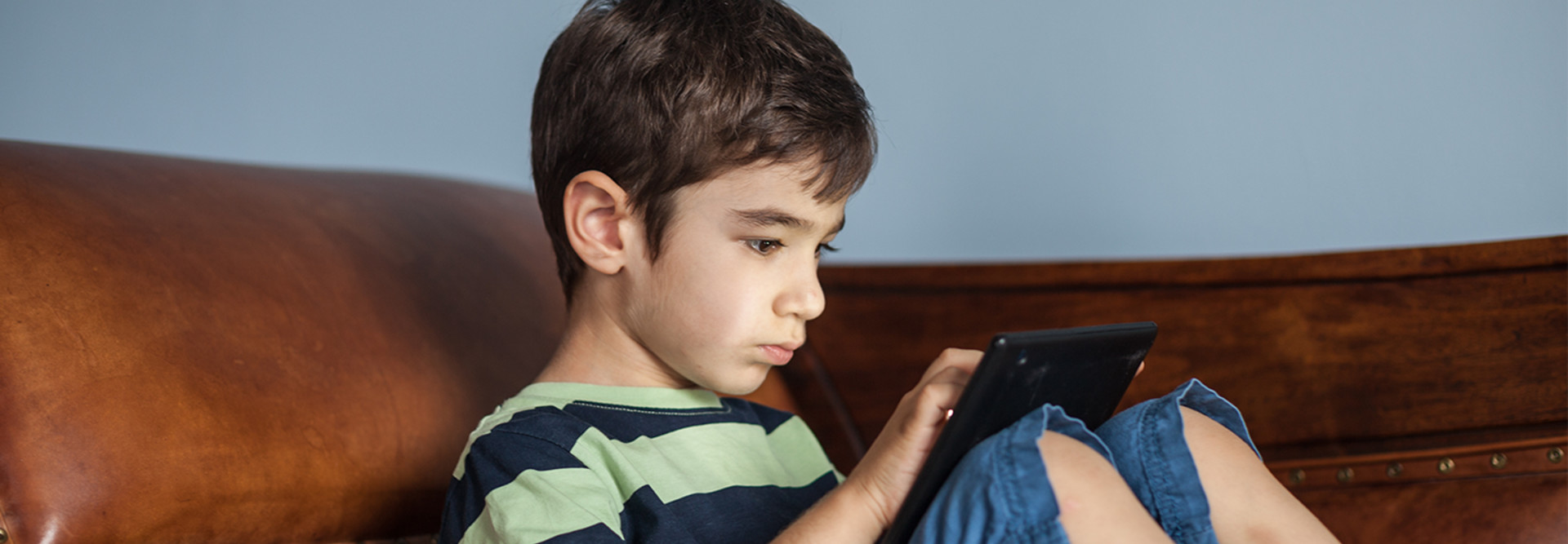 Kid on tablet