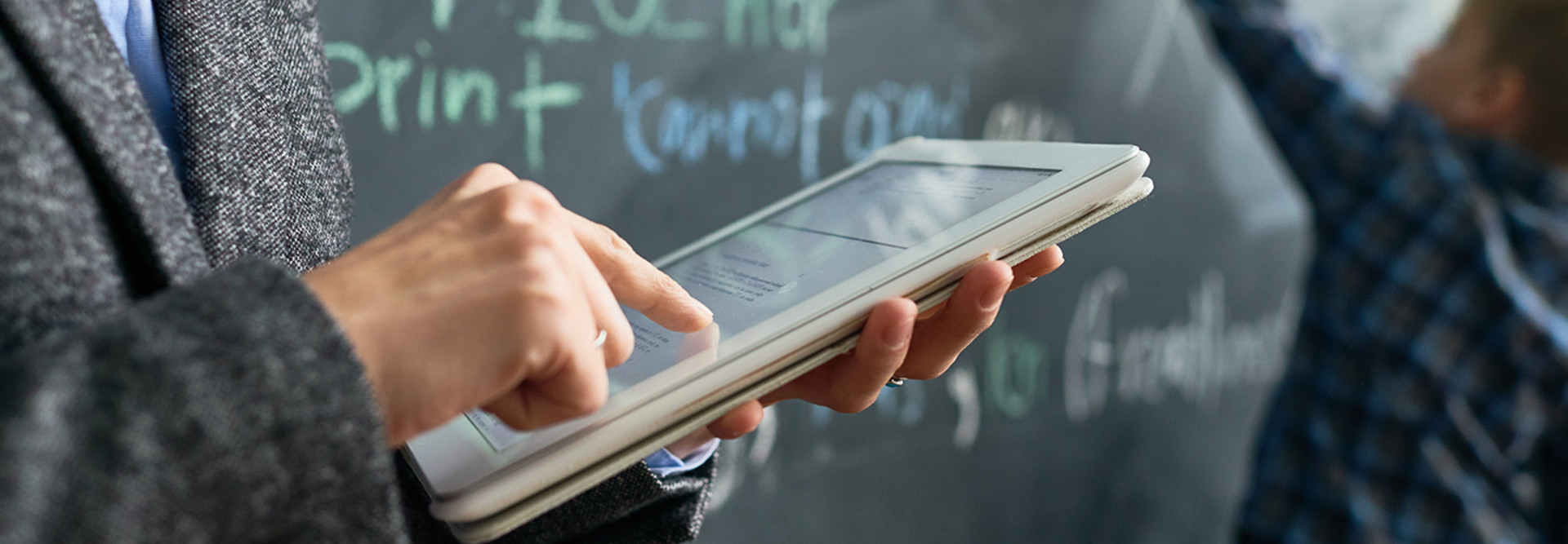 teacher on tablet