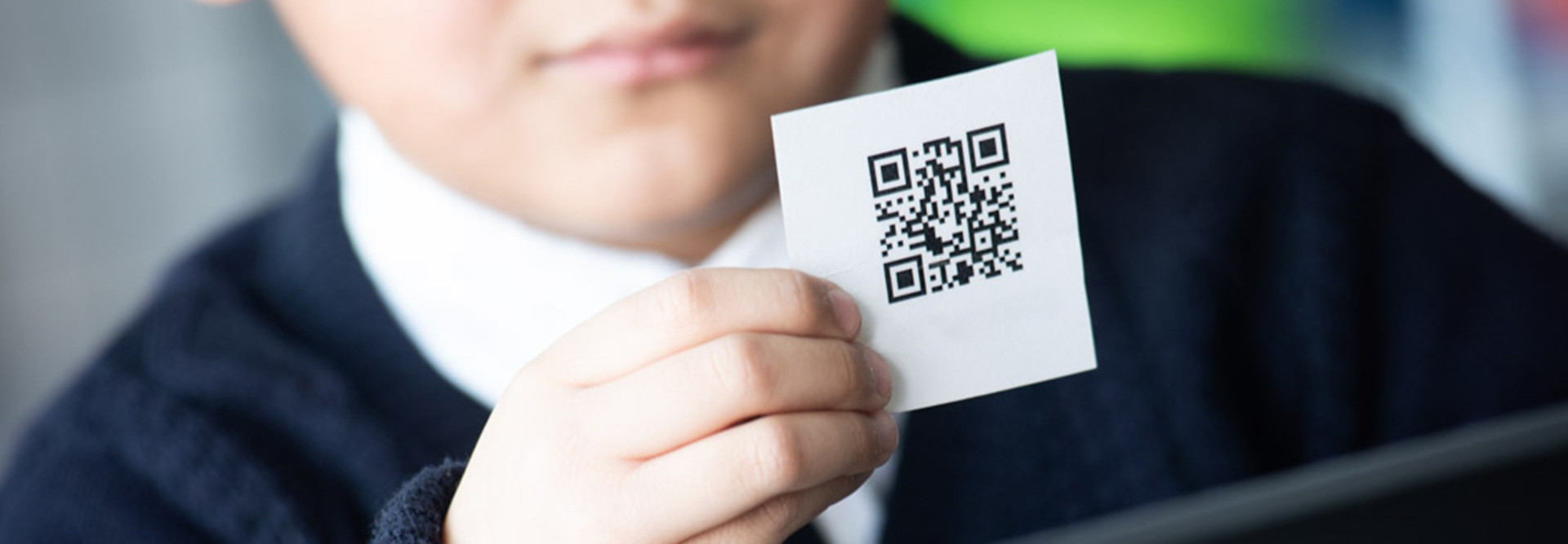 Kid with QR code card