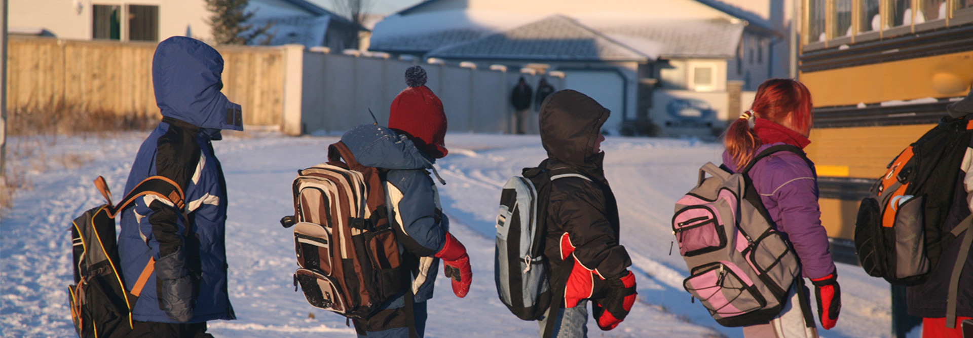 kids in line during a snow day to get on the bus