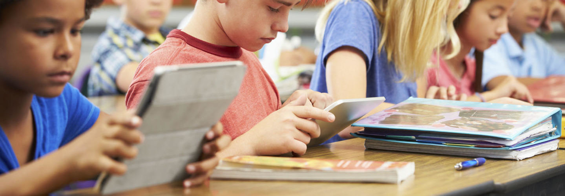 Kids on tablets in class