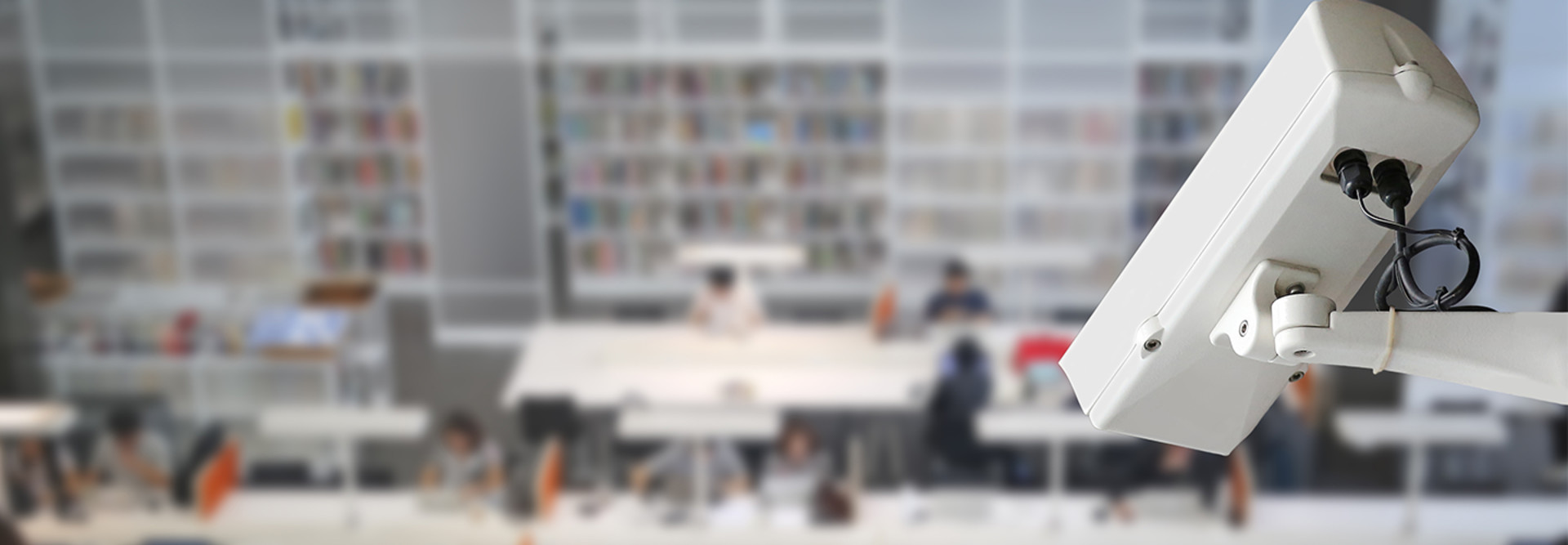 Camera overlooking students in the library