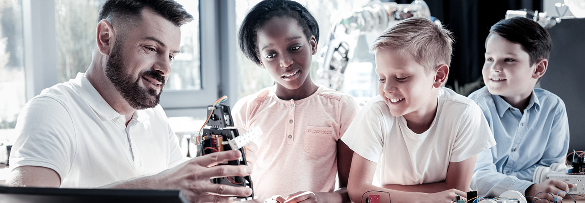 Kids with teacher and robot