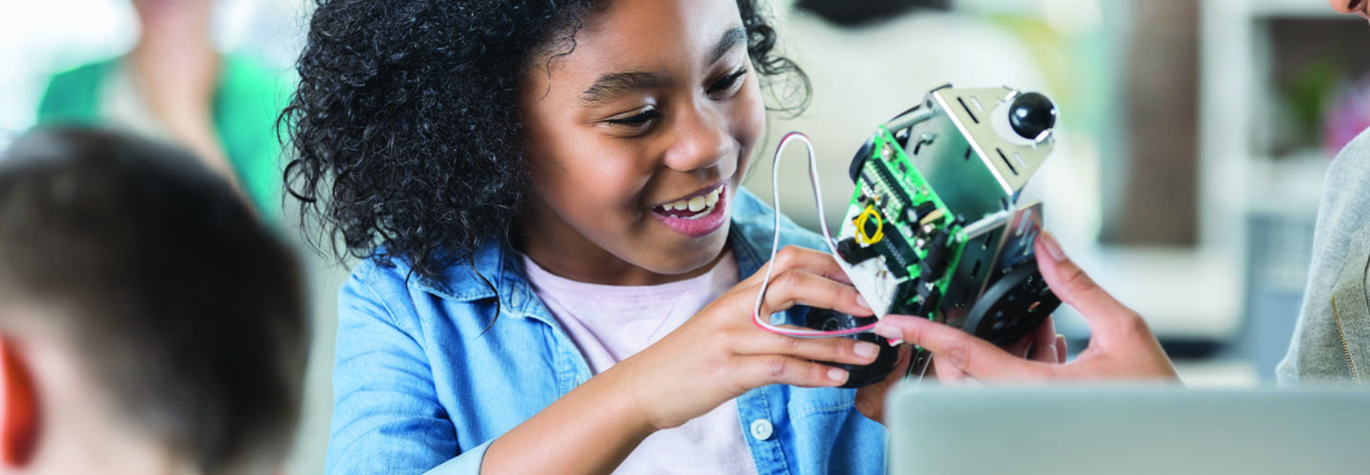 girl building robot