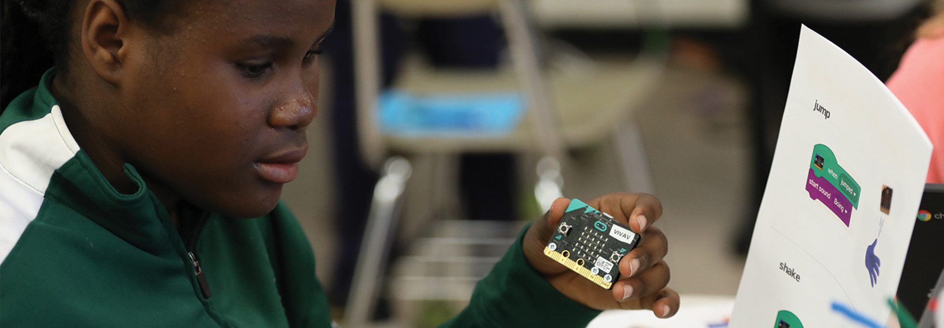 boy breaking apart laptop