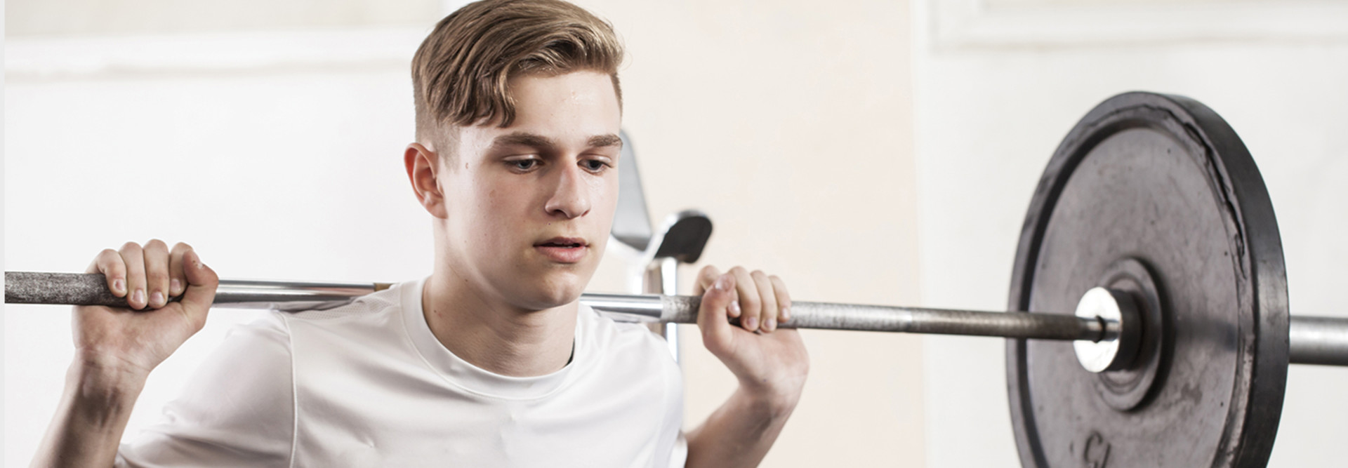 young man with a barbell
