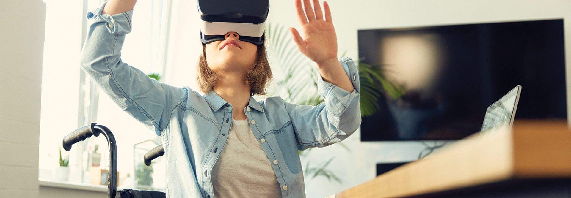 teenager in wheelchair using VR