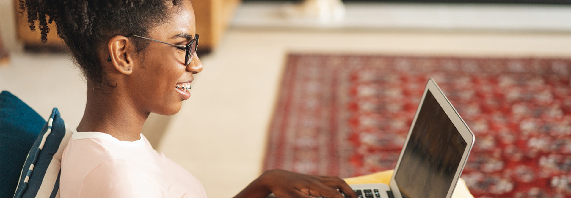 teenage girl using laptop