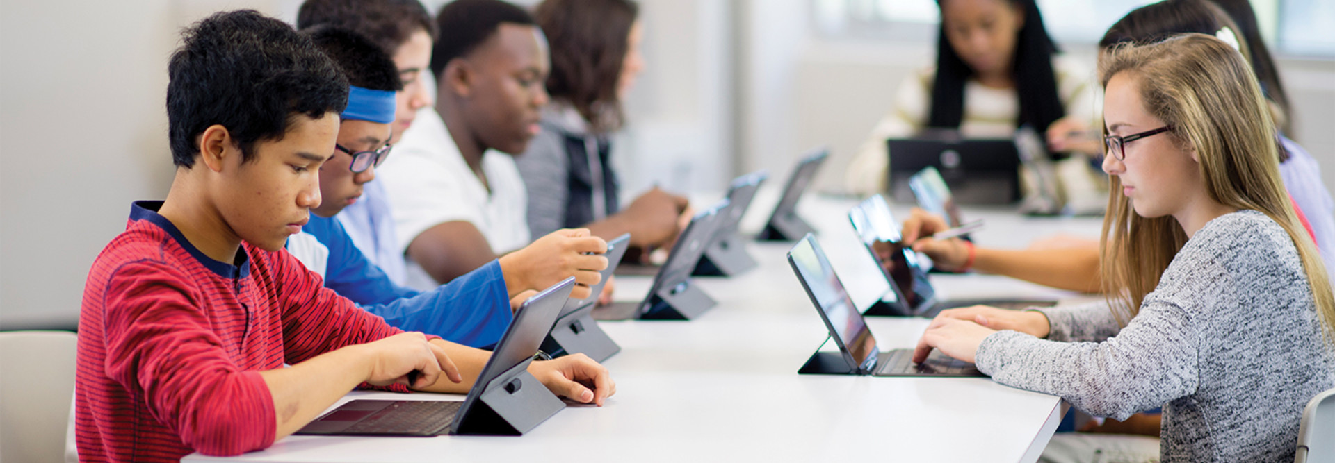 students using tablets in a classroom