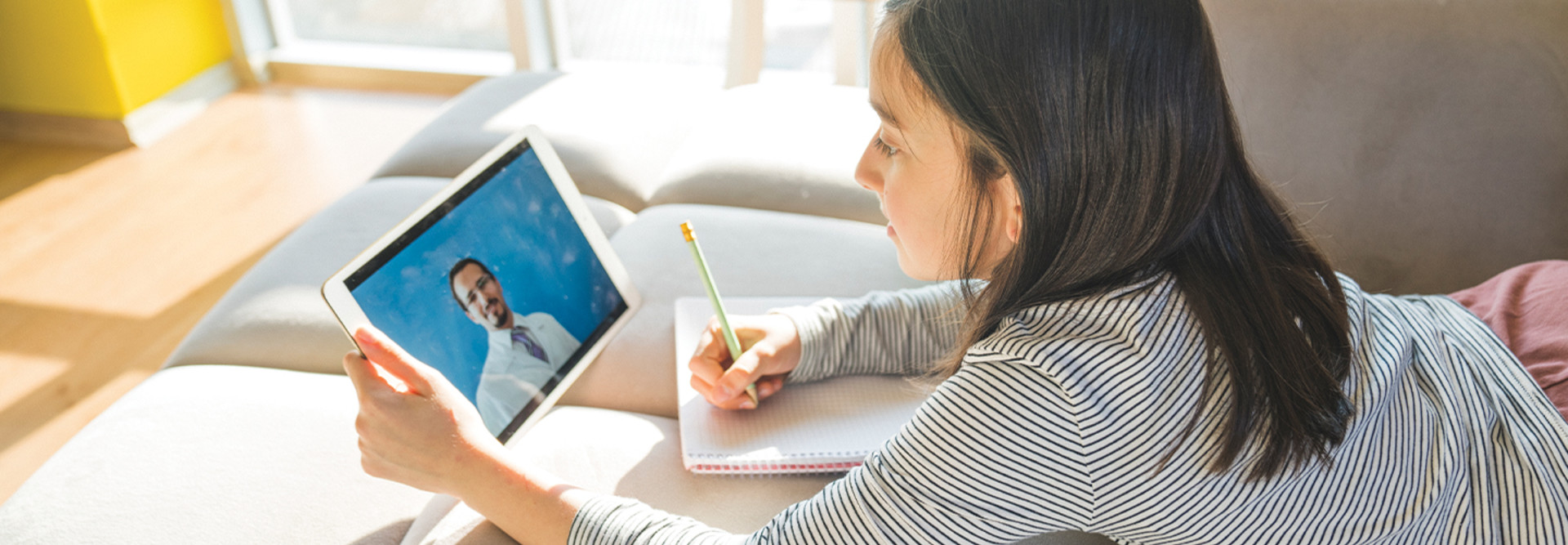 girl studying online from tablet