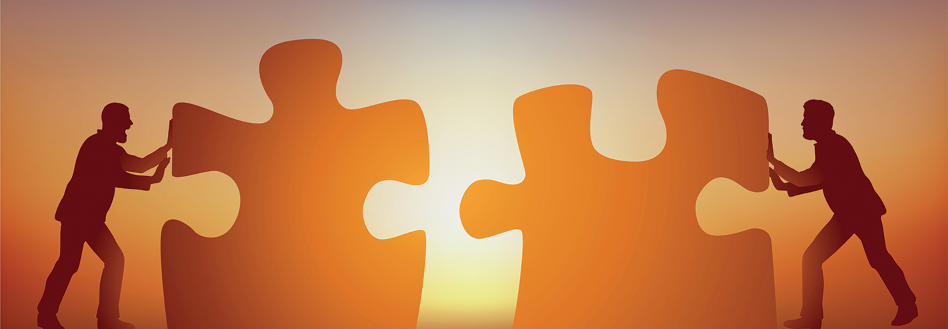 two men putting a puzzle together concept photo of partnership