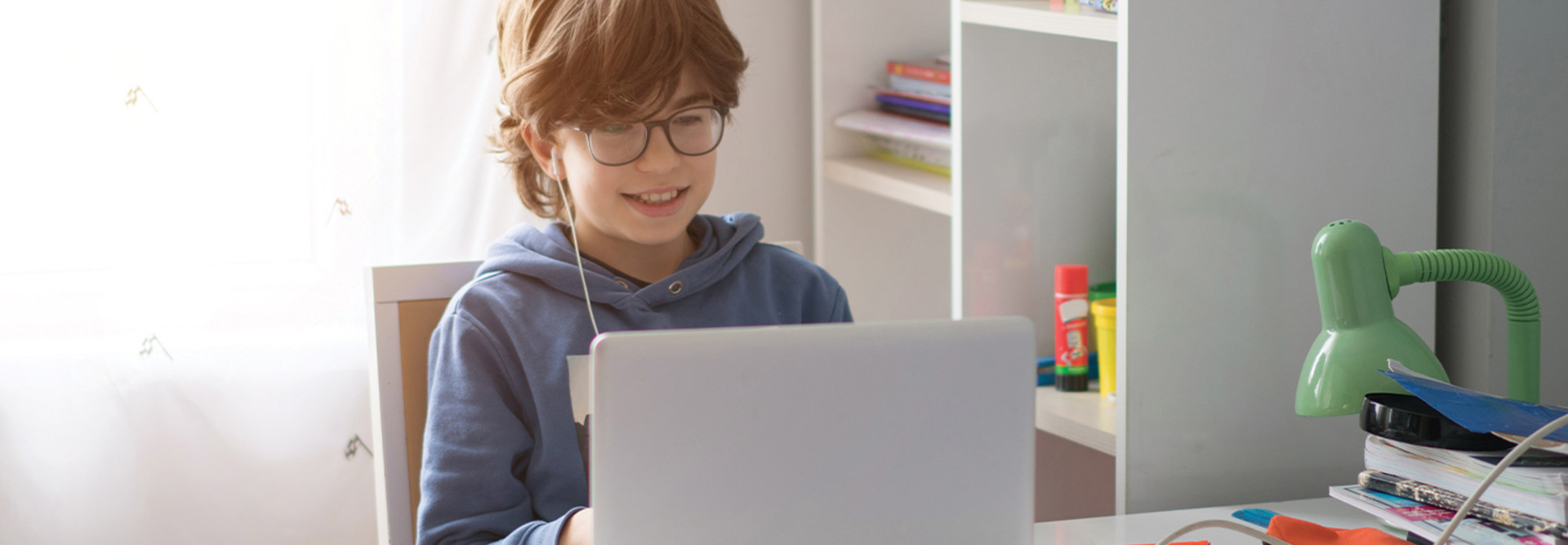 boy using laptop at home