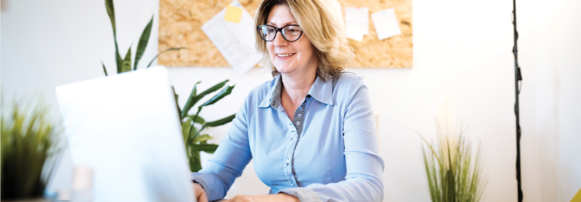 woman using laptop to teach online