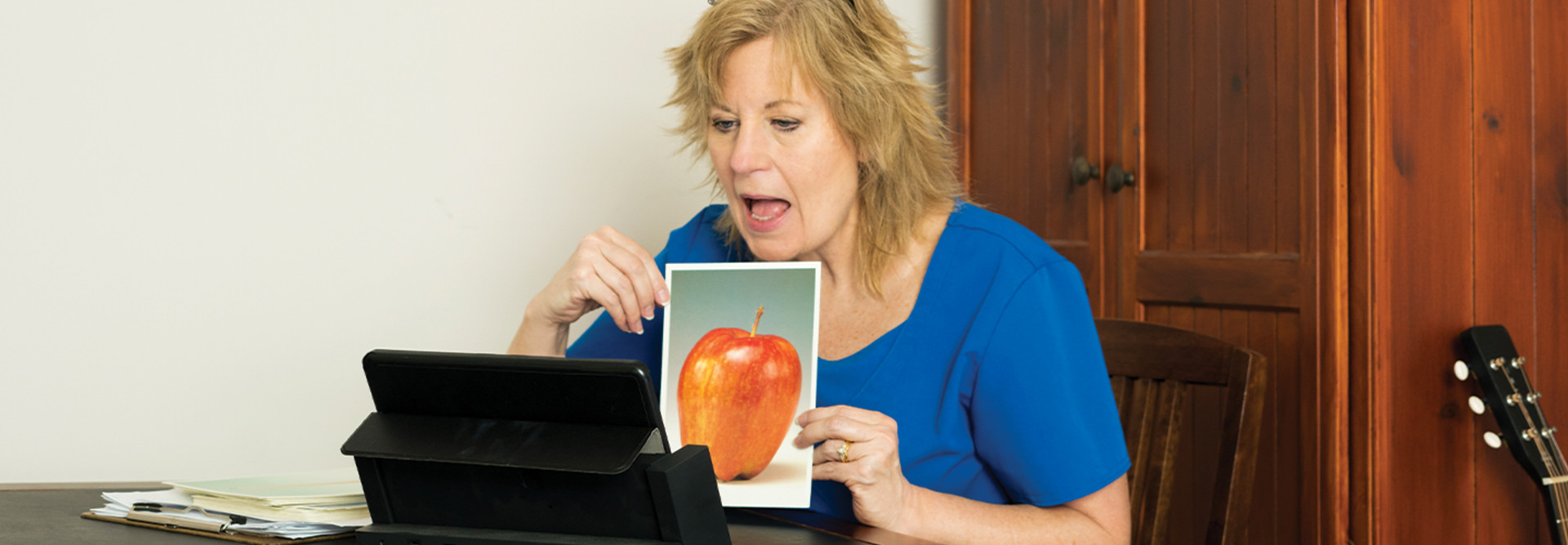 woman doing speech-language therapy online