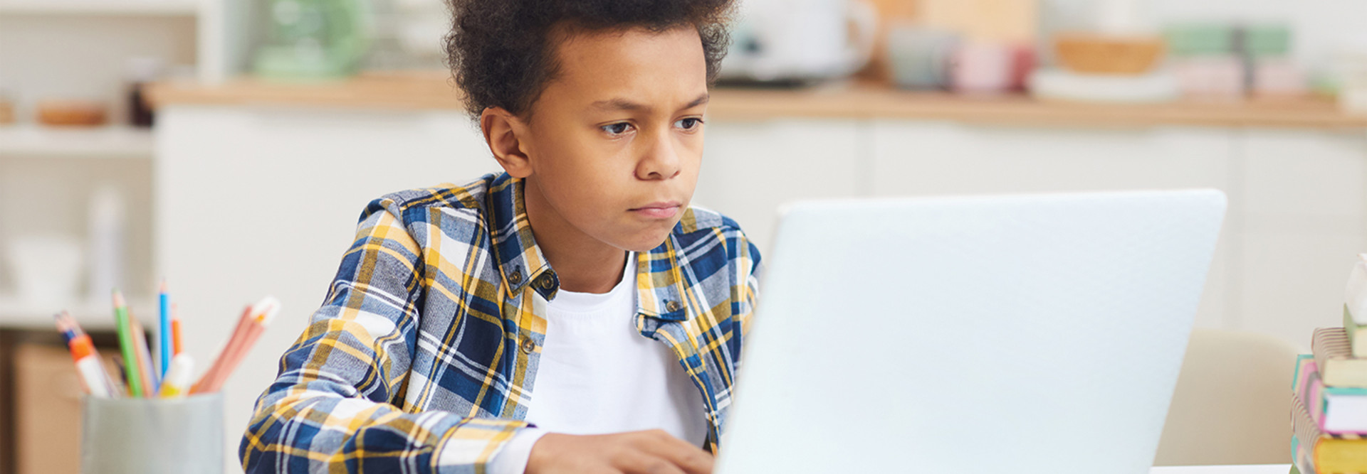 boy doing remote learning 