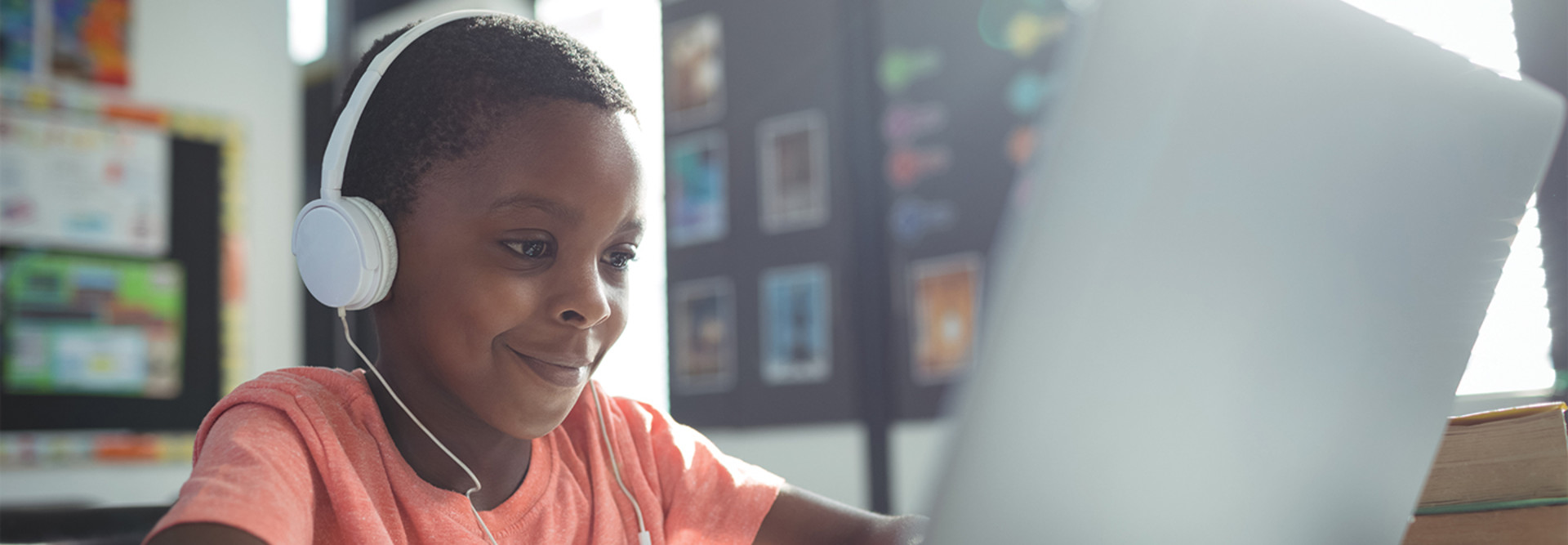 boy with headphones with laptop
