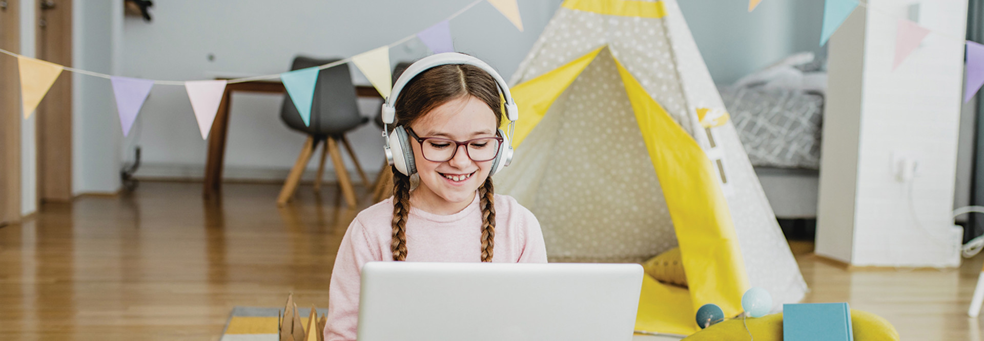 Girl using laptop for online school