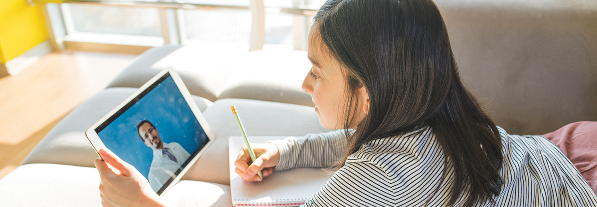 Girl remote learning on tablet 